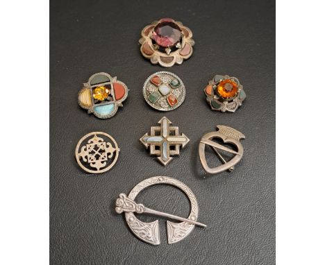 EIGHT VARIOUS SCOTTISH SILVER BROOCHESincluding four agate and stone set examples, one with entwined Celtic decoration by Mal