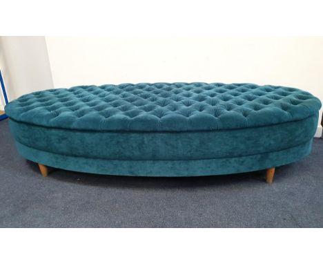 LARGE OVERSIZE STOOL upholstered in teal velour fabric, with button back detail to cushion and raised on four tapering wooden