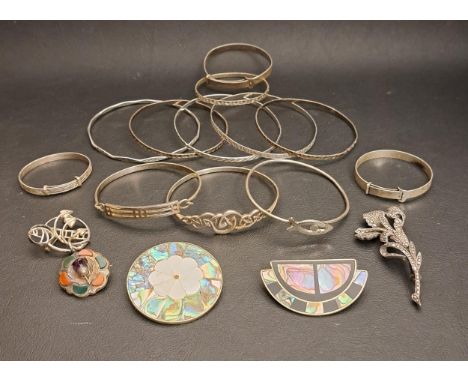 SELECTION OF SILVER JEWELLERYcomprising nine bangles including a Charles Rennie Mackintosh style example and another with ent