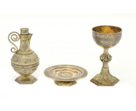 A VICTORIAN GOTHIC SILVER GILT COMMUNION SET FOR THE VISITATION OF THE SICK  comprising chalice and paten and flagon and stop