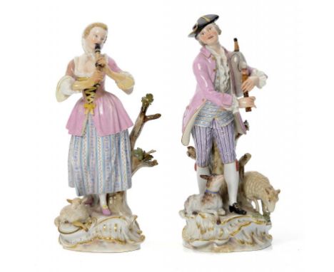 A PAIR OF MEISSEN FIGURES OF PIPING SHEPHERDS, LATE 19TH/EARLY 20TH C  the rococo base set with a dog and sheep or lamb,  24c