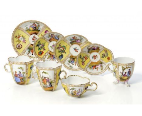 FOUR GERMAN PORCELAIN YELLOW GROUND CABINET CUPS AND SAUCERS, EARLY 20TH C   painted with panels of figures alternating with 