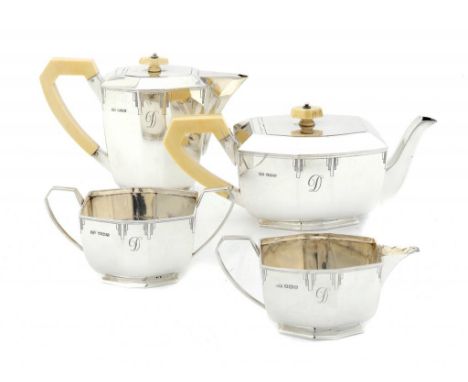 A GEORGE VI SILVER FOUR PIECE TEA SERVICE the teapot and lidded jug with integral hinge and ivory knop and handle, lidded jug