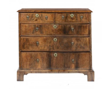 A QUEEN ANNE  WALNUT AND FEATHERBANDED CHEST OF DRAWERS, EARLY 18TH C  with quarter veneered top and moulded lip, 90cm h; 53 
