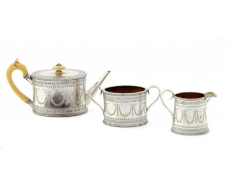 A VICTORIAN SILVER BACHELOR'S TEA SERVICE  of beaded oval shape, the teapot with integral hinge and ivory knop and handle, 10