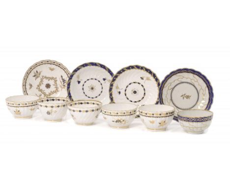 SIX WORCESTER BLUE AND GILT TEA BOWLS AND FOUR SAUCERS, C1790 of shanked or reeded form, several patterns, saucer 13cm diamet