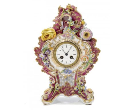 AN ENGLISH PORCELAIN FLORAL ENCRUSTED AND PAINTED CLARET GROUND MANTLE CLOCK, C1840 with French bell-striking movement, the e
