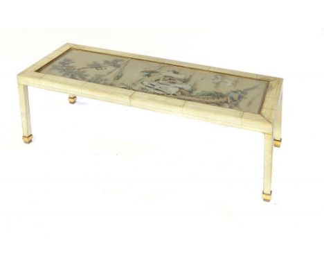 A CREAM AND GILT CHINOISERIE  PAINTED LOW TABLE, 20TH C  the top inset with a 19th c Chinese   scroll painting under glass,  