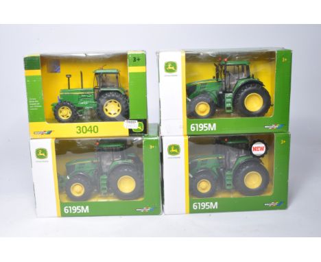 A group of four 1/32 John Deere Model Tractor issues from Siku and Britains. Some with repairs / modifications. All with hand