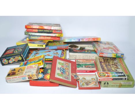 A large quantity of vintage children's games. Majority appear used. Not checked for completeness. 
