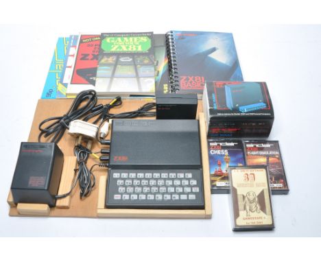 Vintage ZX81 Spectrum Computer with accessories, games and literature as shown. 