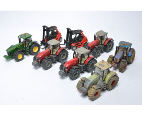 A group of Siku 1/50 diecast model tractor issues, some weathered. 