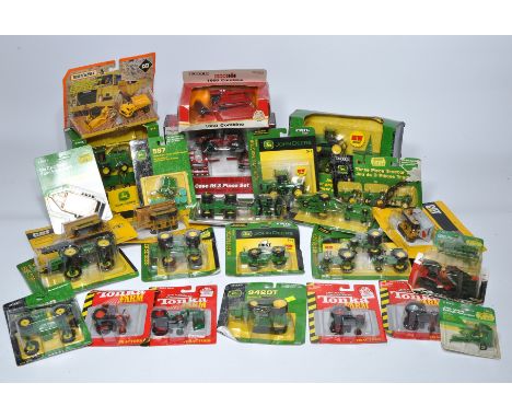 A large collection of 1/64 diecast farm model issues, mostly from Ertl, to include both tractor and implements from various b