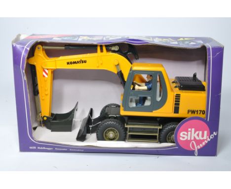 Siku 1/16 plastic construction model issue comprising Komatsu Wheel Loader. Excellent in box (box does have storage wear). 