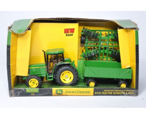 Ertl 1/32 diecast farm model issue comprising John Deere 6410 Tractor and Implement Set. Excellent in box, box does have stor