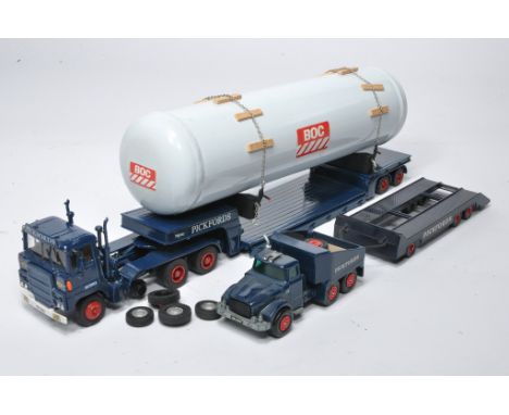 A group of Pickfords liveried model truck issues including ASAM or similar tractor, low loader and tank load plus code 3 Matc