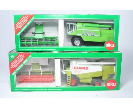 Siku 1/32 diecast farm model issues comprising Claas Lexion and Deutz Fahr combine. Both look to be excellent, in original bo