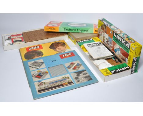 Various vintage construction themed toys including Lego System Fold-out playmat, sleeved base set plus other items including 