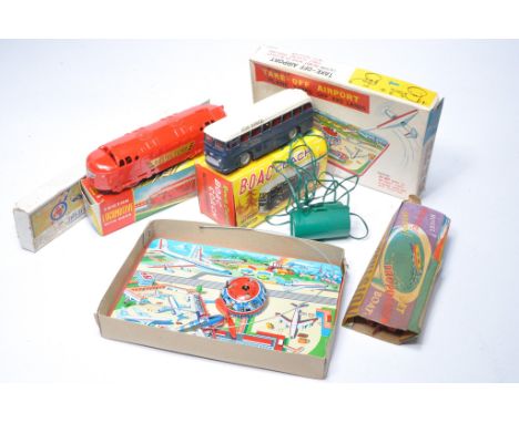 A group of vintage mechanical toys including BOAC bus, locomotive and others as shown. 