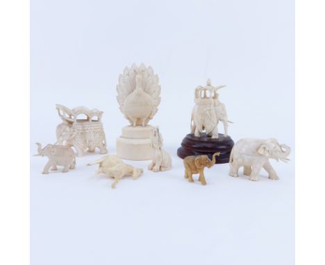 Collection of Nine (9) Carved Ivory Animals. Includes elephants, bird, horse, foo lion. Unsigned. Largest measures 3-3/4" H. 