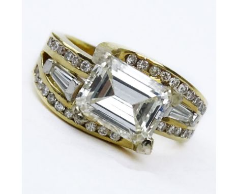 Approx. 3.0 Carat Emerald Cut Diamond and 14 Karat Yellow Gold Ring accented throughout with Baguette and Round Brilliant Cut