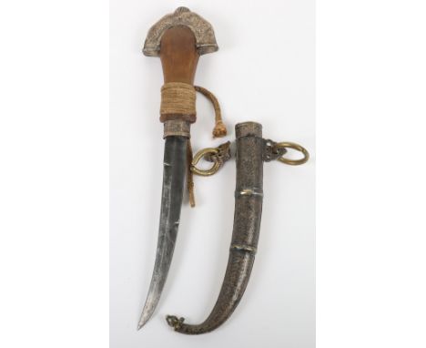 * ^ Large Composite Moroccan Dagger Jambya c.1900, curved blade of conventional form, one piece rhino horn grip, silver pomme