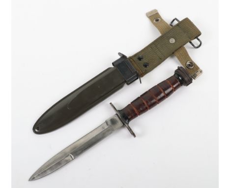 US M4 Knife Bayonet, housed in its M8A1 scabbard with webbing belt frog. Un-marked knife blade measuring 16 ¼ cms, overall 31