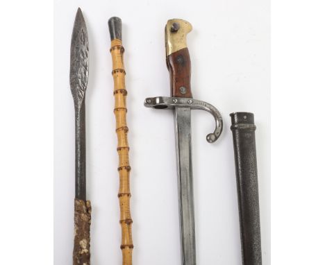 French Gras Bayonet, with two piece wooden grips, brass pommel and steel pommel with muzzle ring. Housed in its steel scabbar