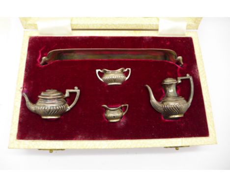 A hallmarked silver miniature four piece tea service with tray, tray 14.5cm, Birmingham 1972