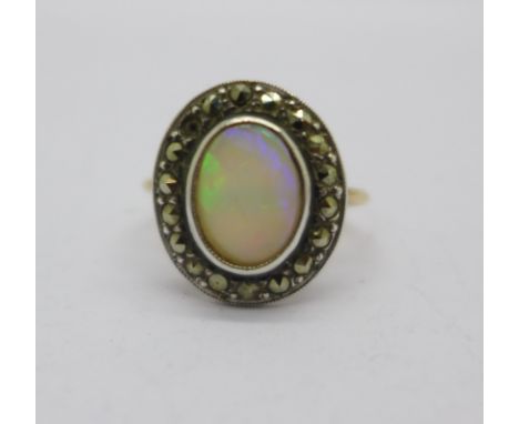 An 18ct gold, opal and marcasite ring, one marcasite missing, 2.7g, K