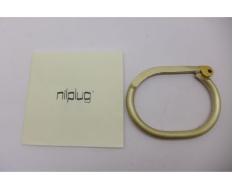A Nilplug 18ct gold, sterling silver and Shakudo designer bangle, boxed