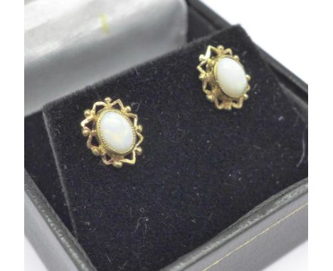 A pair of 9ct gold and opal stud earrings