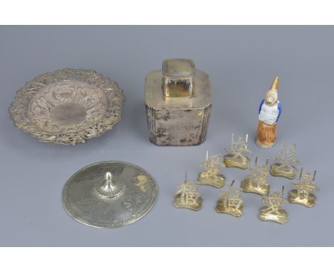 A Chinese silver tea caddy, a Chinese silver dish stamped Woshing Shanghai, a white metal cover, six menu card holders in aus