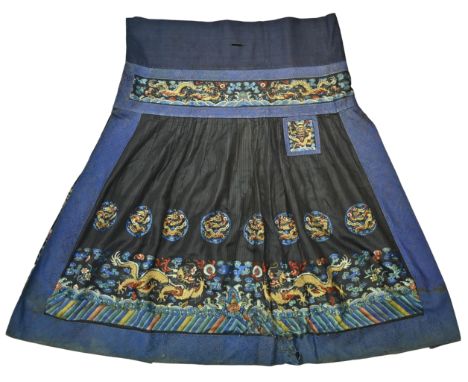 A Chinese 19th C. Qing Dynasty Silk embroidered dragon skirt. With gold thread decoration of five-clawed dragons in roundels 
