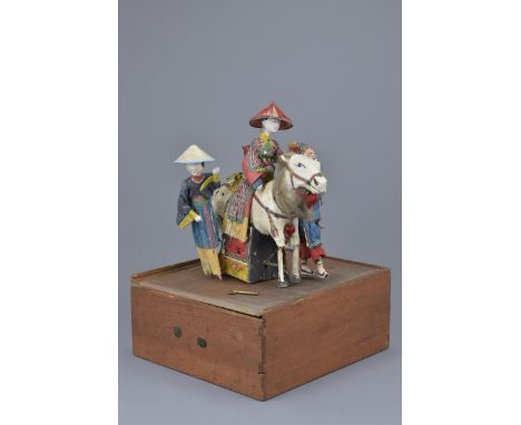 A rare Chinese 19/20th C. mechanical automaton toy figure of a lady on horseback accompanied by a Peking opera figure and fem