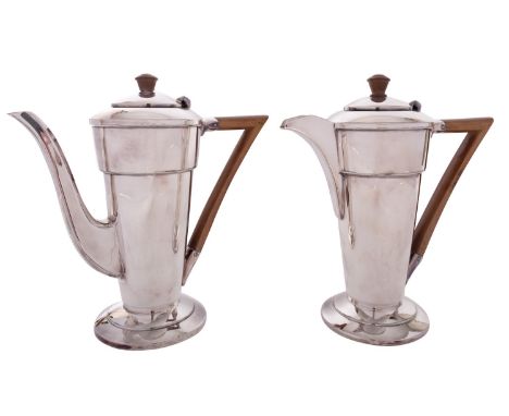 A pair of Art Deco silver plated cafe au lait pots by Walker & Hall, Sheffield circa 1930, with composition finials and angul