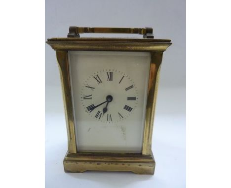A 19th century brass carriage clock, the case with shaped pillars