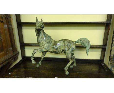 A bronze figure of an energetic lean stallion, 75 cm maximum
