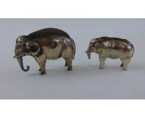 An Edwardian silver pin cushion, Adey & Lovekin Ltd, Birmingham 1907 in the form of an elephant, 4cm high, an Edwardian silve