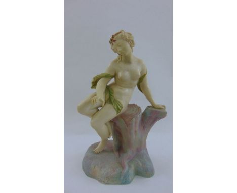 A Royal Worcester shot enamel, porcelain figure of a female sitting upon a tree stump, date marked for 1898, 37 cm tall
