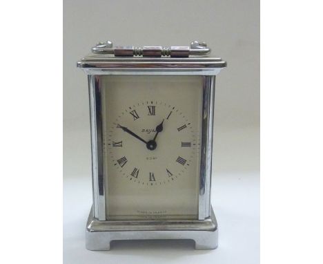A traditional carriage clock with chromed case by Bayard with 8 day movement