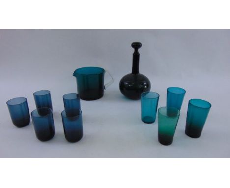 A collection of green glass tumblers (9), a further jug with clear loop handle and a mallet shaped decanter with drawn neck a