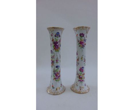 A pair of Dresden trumpet shaped vases with hand painted floral bouquets within gilt reserves, 40 cm high approximately