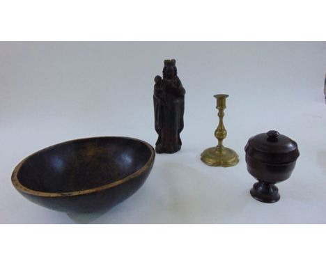 An antique carved timber model of Madonna and child with painted detail, a late 18th century brass candlestick, a treen bowl 