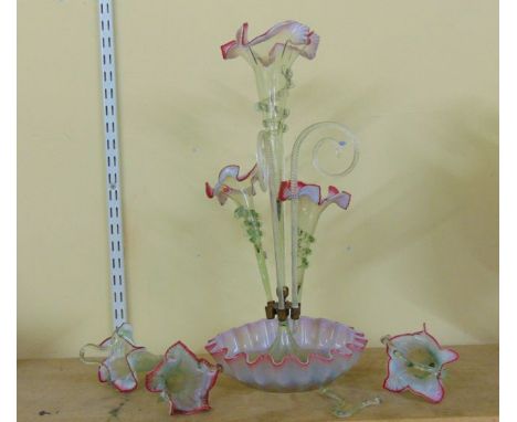 A Victorian epergne with fluted basin, central trumpet flanked by further shorter trumpets, hanging baskets, etc