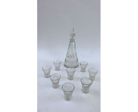 A heavy cut glass steeple shaped decanter, 8 conical shaped shot glasses and five pin trays