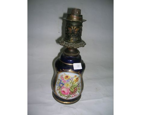 A French moderator table lamp with porcelain body in blue and gilt with decorated floral design, the burner marked T Hadrot