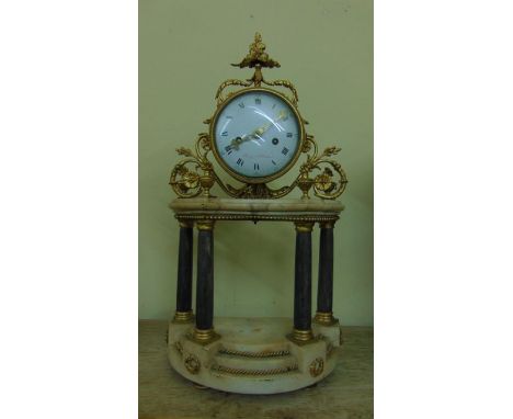 A 19th century French mantle clock in the classical style, the portico base in cream and grey marble, the drum movement set w