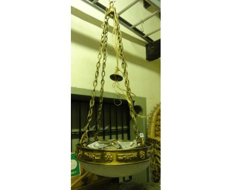 A good quality hanging ceiling light with four chain links supporting a cast lacquered brass ring with applied foliate and fu