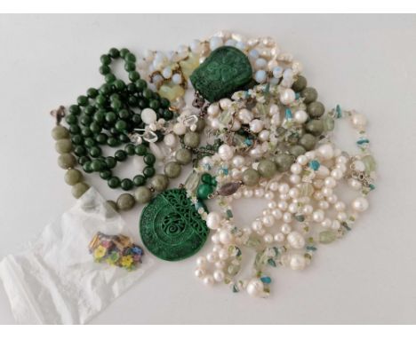 A quantity of jade and pearl beads etc.